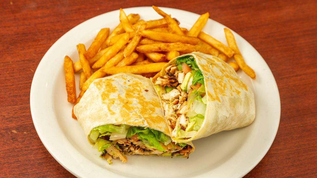 Tender Chicken Wrap · Grilled tender chicken with avocado, plum tomatoes, mixed greens and herb dressing. Wrapped in a soft flour tortilla. Served with choice of side.