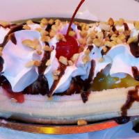 Banana Split · Served with choice of ice cream, banana, walnuts, chocolate syrup and whipped cream.