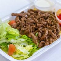Steak Over Rice · Shredded grilled beef strips with modi-spices served with rice or over bed of lettuce with s...