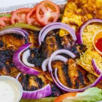 Whole Bbq Chicken · BBQ chicken glazed with special medi- marinated sauce served over rice with salad and garlic...