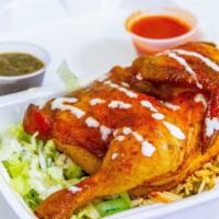Rotisserie Half Chicken · Half chicken served with special modi- marinated sauce over rice with salad and garlic sauce...