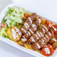 Kufta Kabob · Ground beef with vegetables served with rice or over a bed of lettuce with pita bread.