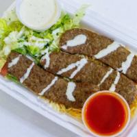 Lamb Gyro Over Rice · Lamb pieces over rice and salad, or a bed of lettuce
