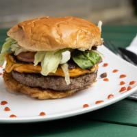 Mega Burger · Double patty, shredded cheese, lettuce, tomato, onion, and mayo.