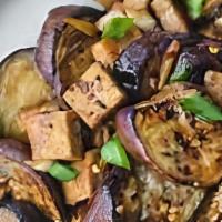 Eggplant Tofu · Sliced round island eggplant sauteed with steamed tofu, basil and green onions in brown chil...