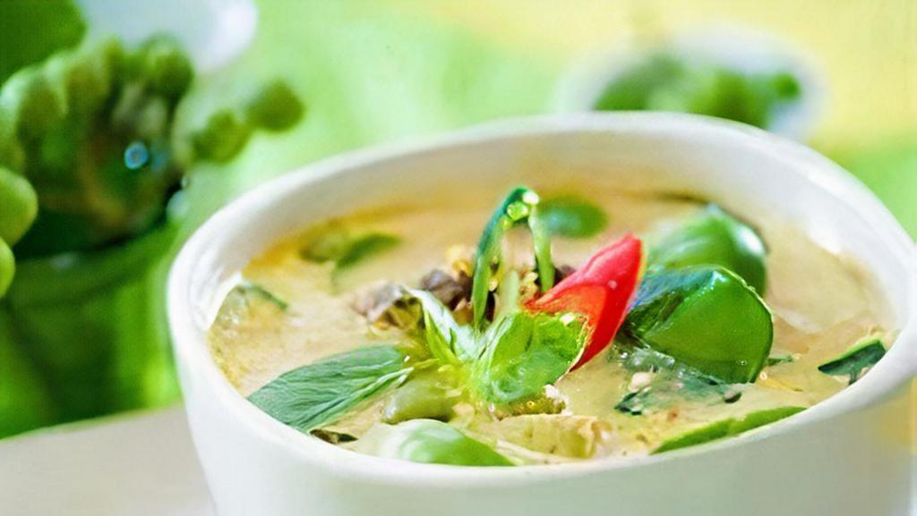 Green Curry · Green curry paste in coconut milk with bamboo shoots, eggplant, basil and bell pepper.