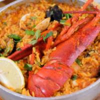 Paella · Rice served with lobster, shrimp, squid, mussels, and clams.