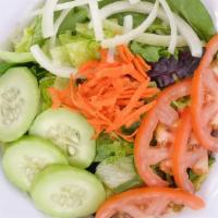House Salad · Greens, carrots, tomatoes, and cucumbers.