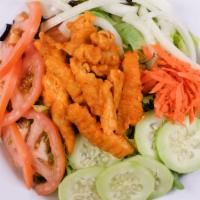 Buffalo Chicken Salad · Buffalo chicken strips served on top of a house salad and served with blue cheese dressing.