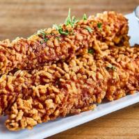 Crispy Rice Chicken Sticks · Chicken tender fried with crispy rice puffs with parsley on the top /
Honey Mustard On the s...