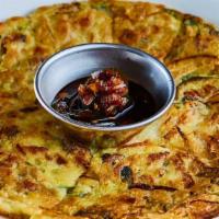Jeon (Seafood Pancake) · Pan fried flour mixed with Seafood Mix. 
Yuzu Soy Sauce On the Side