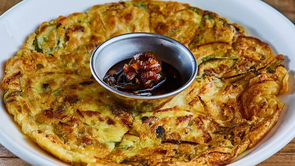 Jeon (Seafood Pancake) · Pan fried flour mixed with Seafood Mix. 
Yuzu Soy Sauce On the Side