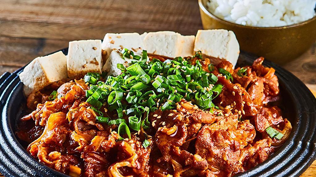 Jeyook Bokum (Serve 1-2) · Spicy Pan-Fried Pork, Kimchi, Onion, Scallion, Red Pepper with Tofu and sliced lemon / Comes with Steamed Rice on the side
