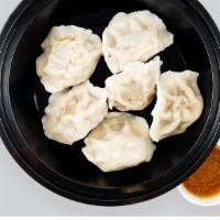 Steamed Pork Dumplings (6 Pc) · pork and cabbage dumplings, with soy dipping sauce on the side