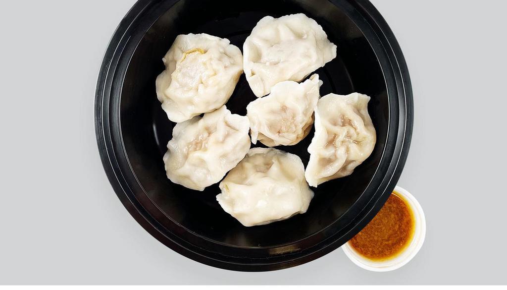Steamed Pork Dumplings (6 Pc) · pork and cabbage dumplings, with soy dipping sauce on the side