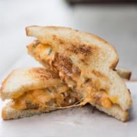 Buffalo Chicken · Cheddar, Breaded Chicken, Pickled Jalapenos, Hot sauce and Bleu Cheese on Levain Pullman