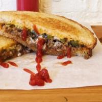 Sloppy Joe Grilled Cheese · Cheddar, mascarpone cheese, Levain Pullman bread, pickled jalapeños and ground beef.