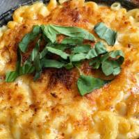 Fried Mac & Cheese · A blend of 3 cheeses (Cheddar, Chevre and Asiago) baked breaded and fried in house. Served w...