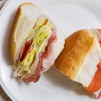 Italian Sandwich (Half Sub) · Includes ham, salami, provolone, lettuce, tomato, oil, and vinegar.