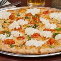 White Pie · Mozzarella, ricotta, basil, cherry tomatoes, garlic, and EVOO.