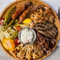 Mix Grill Platter · Bifleki, chicken and pork souvlaki sausage, tzatziki and pita bread.