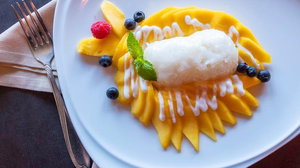 Sweet Sticky Rice With Fresh Mango · Served with coconut milk sauce.