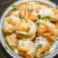 Garlic Knots · Rolled baked garlic bread.