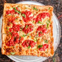Grandma Pie · Extra thin crust pan pizza layered with mozzarella cheese and spotted with garlic and san ma...
