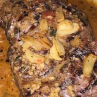 Ribeye Organata · Grilled steak sauteed in a white wine butter sauce with fresh garlic, oregano, spices, and c...