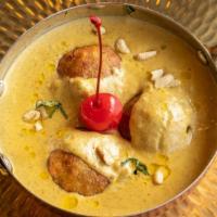 Malai Kofta · Fried paneer and mawa balls cooked and served in rich white sauce. Served with rice.