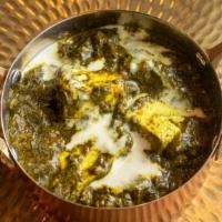 Palak Paneer · Paneer cooked in a creamy spinach sauce. Served with rice.