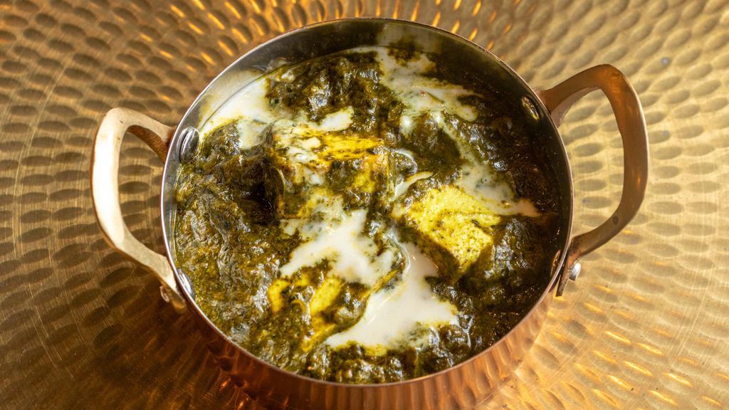 Palak Paneer · Paneer cooked in a creamy spinach sauce. Served with rice.