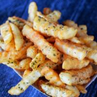 Truffle Fries · Crinkle cut fries splashed with white truffle oil.