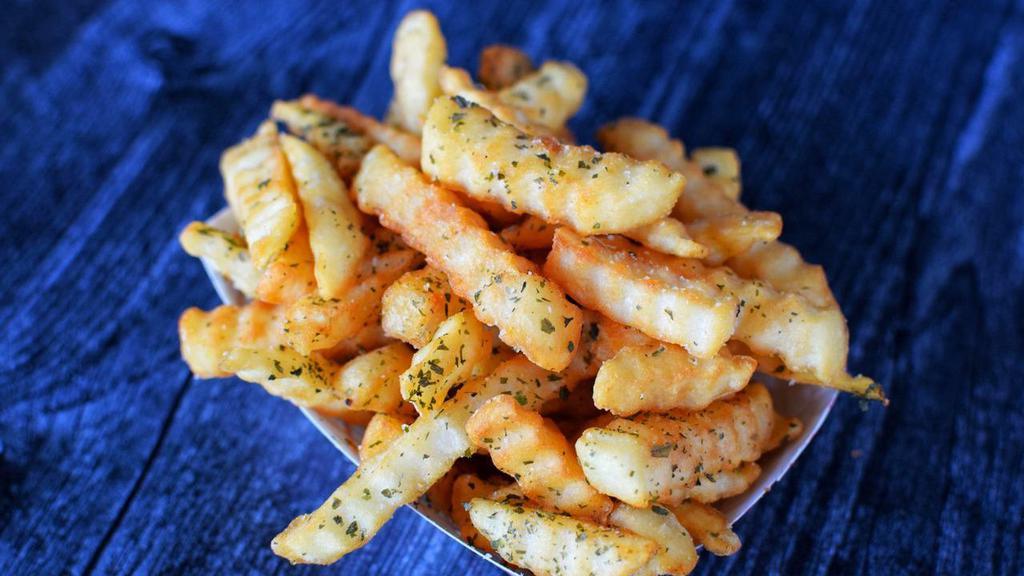 Truffle Fries · Crinkle cut fries splashed with white truffle oil.