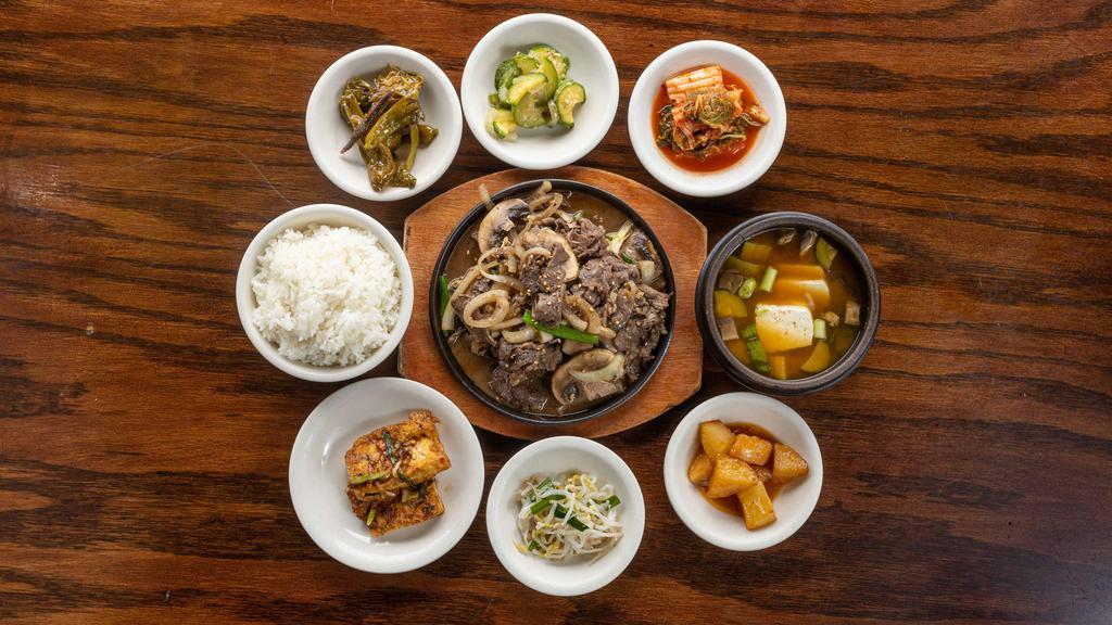 Bulgogi · Thin slices of marinated beef sirloin with assorted mushrooms and vegetables grilled together. comes with a rice and soy bean paste stew.