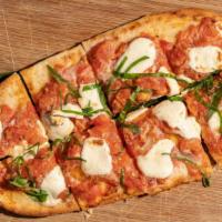 Margherita Flatbread · Naan flatbread topped with roasted herbed tomatoes, fresh mozzarella, and basil