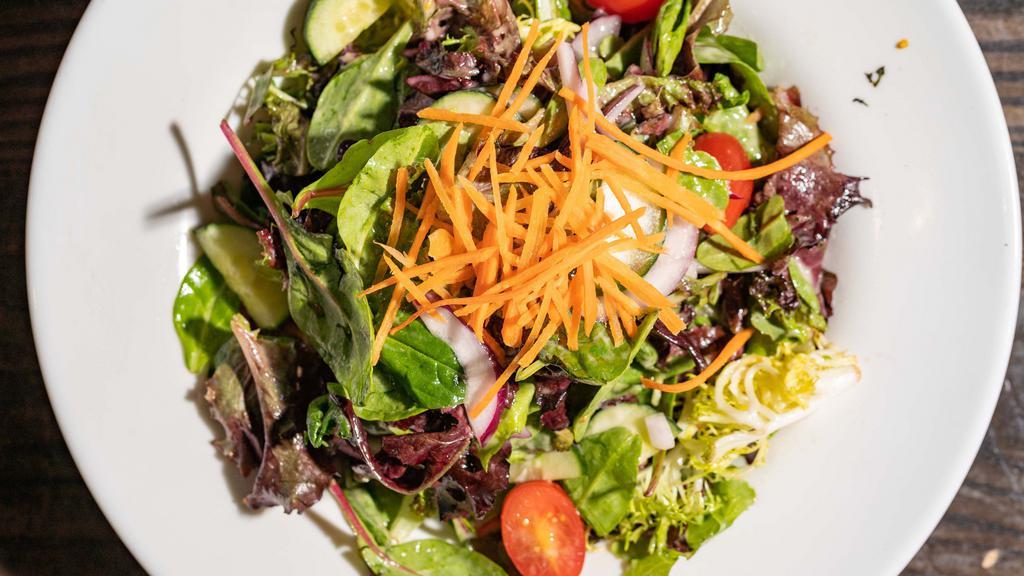 Classic House Salad · Mixed garden greens, onions, cucumber, carrots, confetti tomatoes, our white balsamic vinaigrette
