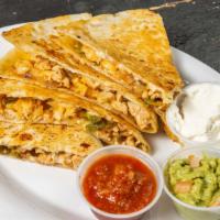 Cajun Chicken Quesadilla · With peppers and onions. Served w/guacamole, salsa & sour cream.