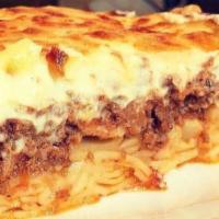 Pastitsio Pi · Penne, ground beef in a light caramelized tomato sauce, topped with a light béchamel sauce a...