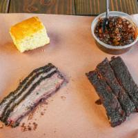Brisket & Ribs Combo · 1/4 lb brisket and 1/4 rack of ribs. Two sides of choice.