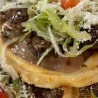 Sopes ( Pcs) · Flat ridged thick handmade Corn Tortilla layered with Beans, your choice of meat,
and Crumbl...