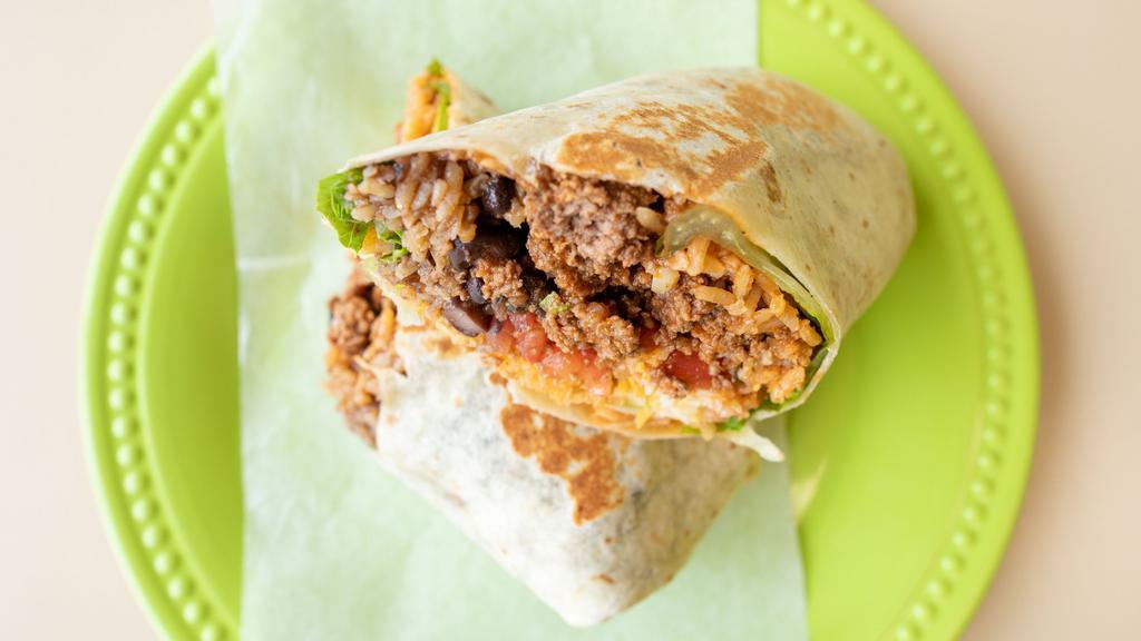 Meat Burrito · Flour or wheat Tortilla; stuffed with choice of protein, Rice, Beans, Muenster Cheese, lettuce, tomatoes and red or Green Salsa on the side.
