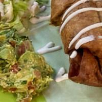 Chimichanga · Deep-fried burrito filled with beefsteak, or shredded chicken, served with Guacamole, sour c...