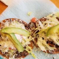 2 Tostada · Two tostadas with your favorite choice of meat.