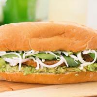 Breaded Steak Torta (Mexican Sandwich) · Portuguese bread roll layered with mayonnaise, refried pinto beans, lettuce, tomato, cheese,...