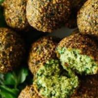 Falafel (5 Pieces) · Falafel is a deep-fried ball or patty-shaped fritter made from ground chickpeas, fava beans,...
