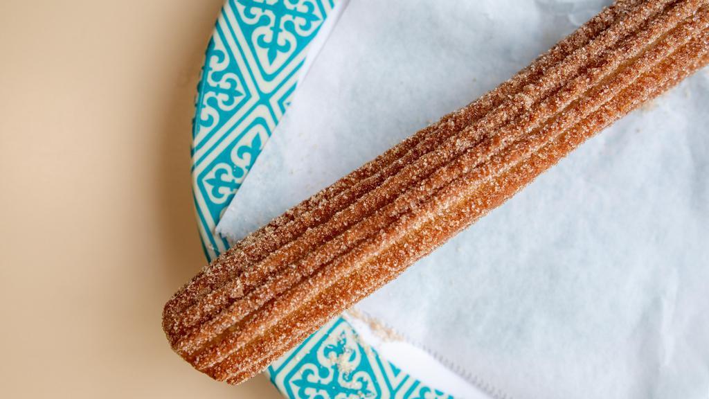 Churros · A sweet snack consisting of a strip of fried dough dusted with sugar and cinnamon.