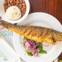 Bronzini · Fried whole fish, served with rice and beans  and salsa criolla.