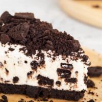 Oreo Cheesecake · A rich and creamy New York-style cheesecake baked with oreos inside a honey-graham crust.