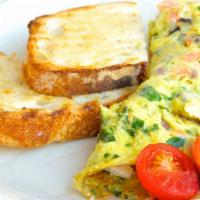 Greek Omelet · Organic eggs with spinach, feta, tomatoes, red and green peppers, onions, and kalamata olive...